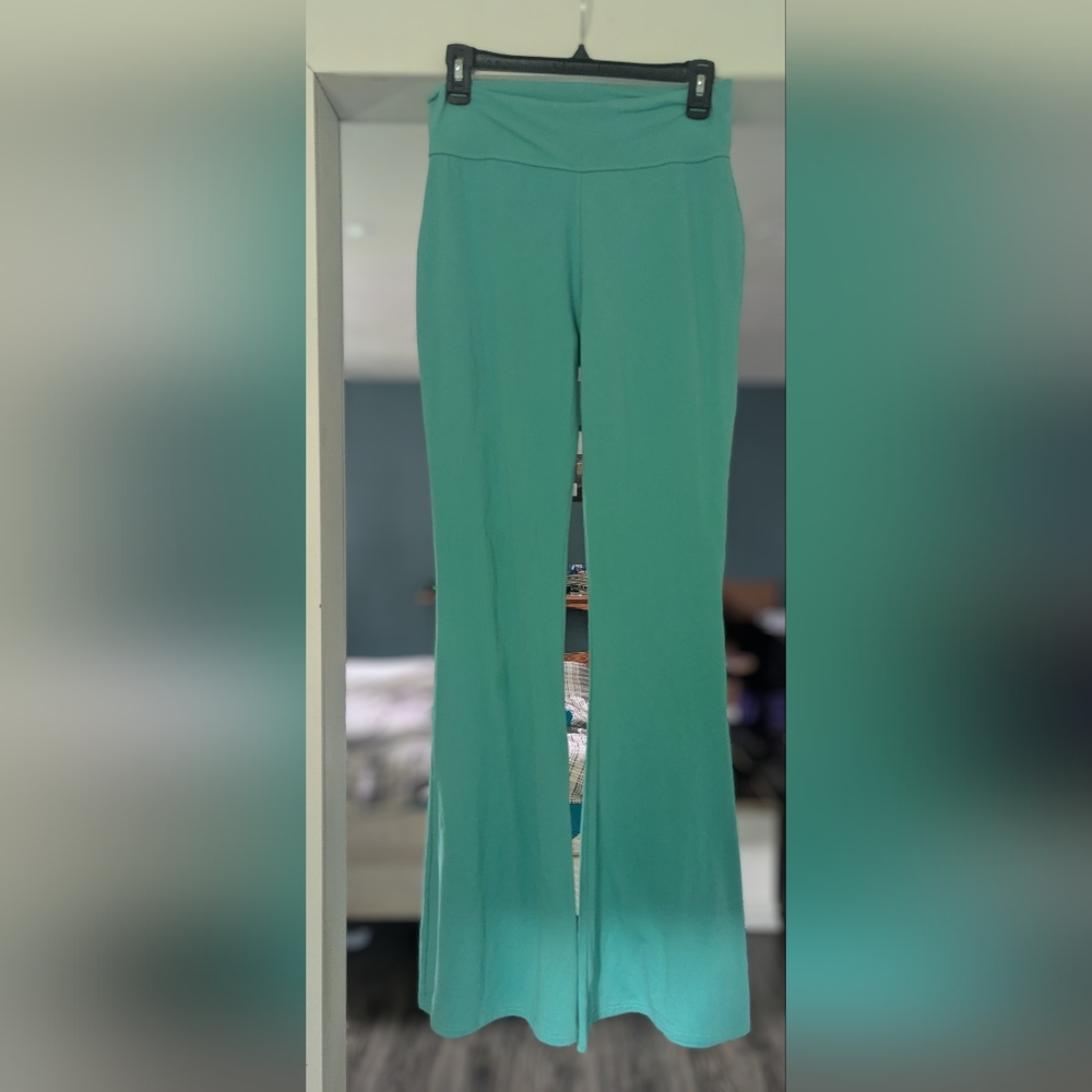 2 Pairs of Crazy Train flare stretch pants in new Condition. Teal & Red in color